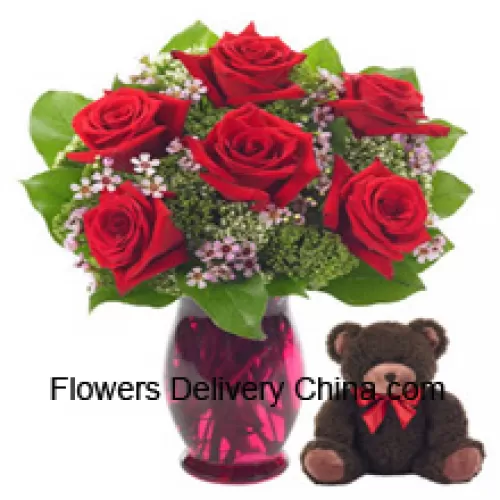6 Red Roses With Some Ferns In A Glass Vase Along With A Cute 14 Inches Tall Teddy Bear