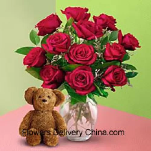 12 Red Roses With Some Ferns In A Vase And A Cute Brown 8 Inches Teddy Bear